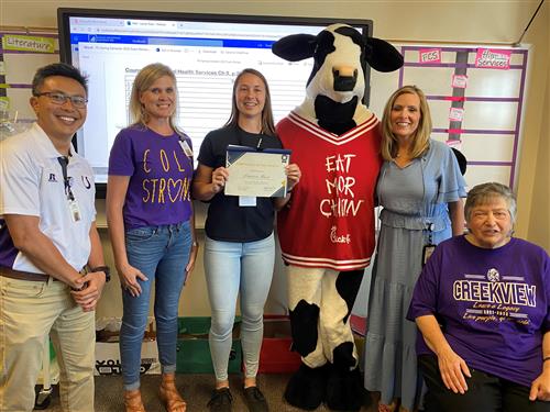 Lauren Rose _ April Substitute of the Month recipient nominated by Creekview.Standing in center and holding certificate